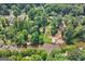 A scenic aerial shot of the home, with lush greenery, a lake, and a dock, perfect for outdoor living at 610 Lake Dr, Snellville, GA 30039