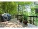 Outdoor back deck with grill and green backyard views at 610 Lake Dr, Snellville, GA 30039