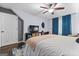 Comfortable bedroom with ceiling fan, tv, and seating area, offers a cozy retreat at 610 Lake Dr, Snellville, GA 30039