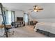 Cozy bedroom featuring vaulted ceilings, ceiling fan, neutral carpeting, and ample natural light at 610 Lake Dr, Snellville, GA 30039
