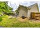 A spacious backyard with a patio area, perfect for outdoor entertaining and relaxation at 345 Morning Star Dr, Temple, GA 30179