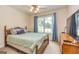 Comfortable bedroom with a ceiling fan, natural light, and cozy ambiance at 345 Morning Star Dr, Temple, GA 30179