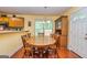 Inviting dining room with natural light, classic furniture, and a charming hutch at 345 Morning Star Dr, Temple, GA 30179