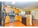 Functional kitchen features stainless steel appliances and ample cabinet space for storage at 345 Morning Star Dr, Temple, GA 30179