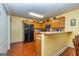 Traditional kitchen with stainless steel appliances, wood cabinets, and a cozy breakfast bar at 345 Morning Star Dr, Temple, GA 30179