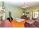 Inviting living room features comfortable leather seating, a fireplace, and ample space for relaxation at 345 Morning Star Dr, Temple, GA 30179