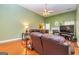 Spacious living room with fireplace, vaulted ceilings, and large windows for natural light at 345 Morning Star Dr, Temple, GA 30179