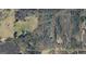 Aerial view showcasing lot location surrounded by lush greenery, road access, and nearby residences at 385 Snead, Fayetteville, GA 30215