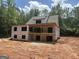 Exterior view of a two-story home under construction, featuring a back porch and exposed framework at 385 Snead, Fayetteville, GA 30215