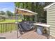 View of the back deck with a grill and outdoor dining space, perfect for entertaining outdoors at 557 Spring Creek Ne Way, Marietta, GA 30068