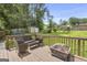 Relaxing back deck featuring outdoor seating, a fire pit, ideal for enjoying evenings outdoors at 557 Spring Creek Ne Way, Marietta, GA 30068
