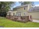 Expansive backyard with a deck, perfect for outdoor gatherings and enjoying the peaceful surroundings at 557 Spring Creek Ne Way, Marietta, GA 30068