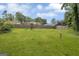 Spacious backyard with a play set and swing set, providing ample space for outdoor activities at 557 Spring Creek Ne Way, Marietta, GA 30068