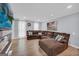 Inviting living room with a spacious sectional sofa, lots of natural light, and sleek flooring at 557 Spring Creek Ne Way, Marietta, GA 30068