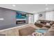 Cozy living room showcasing a fireplace, TV, comfortable seating, and modern interior design at 557 Spring Creek Ne Way, Marietta, GA 30068