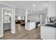 Open concept living area with a modern kitchen, comfortable seating, and lots of natural light at 557 Spring Creek Ne Way, Marietta, GA 30068