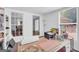 Bright home office space featuring natural light, white trim, and space for organizing projects at 557 Spring Creek Ne Way, Marietta, GA 30068
