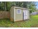 Convenient storage shed in the backyard, offering extra space for tools and equipment at 557 Spring Creek Ne Way, Marietta, GA 30068