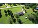 Overhead view of a home with a long driveway and generous green surroundings at 12621 Highway 142, Oxford, GA 30054