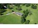 Aerial shot of a home with an expansive yard and a tree-lined driveway at 12621 Highway 142, Oxford, GA 30054