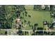 Bird's eye view of home on a verdant lot with a pond and outbuildings at 12621 Highway 142, Oxford, GA 30054