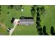 Aerial view showcasing the roof and the vast green landscape surrounding the property at 12621 Highway 142, Oxford, GA 30054