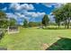 Expansive green backyard with mature trees, providing a serene and private outdoor space at 12621 Highway 142, Oxford, GA 30054