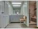 Bathroom featuring a double vanity, linen closet, and walk-in shower at 12621 Highway 142, Oxford, GA 30054