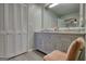 Bathroom with linen closet, double vanity and chair at 12621 Highway 142, Oxford, GA 30054