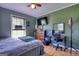 Bedroom with a ceiling fan, desk, and good natural light at 12621 Highway 142, Oxford, GA 30054