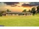 Charming single-story home with a well-maintained lawn and mature trees at 12621 Highway 142, Oxford, GA 30054