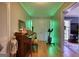 Bright foyer features a piano, exercise bike, and double doors, creating an inviting entrance with modern amenities at 12621 Highway 142, Oxford, GA 30054