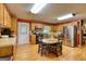 Cozy kitchen with light wood cabinetry, stainless steel appliances, and a charming breakfast nook at 12621 Highway 142, Oxford, GA 30054