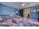 Comfortable living room with plush seating and a built-in shelving unit at 12621 Highway 142, Oxford, GA 30054