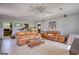 Spacious living room with tile flooring, ceiling fans, and comfortable seating at 12621 Highway 142, Oxford, GA 30054
