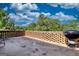 View of the brick patio with a grill, ideal for enjoying outdoor cooking and relaxation in the backyard at 12621 Highway 142, Oxford, GA 30054