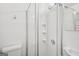 Bright bathroom showcasing a shower with glass doors, white toilet and sink at 2858 Valley Ridge Dr, Decatur, GA 30032