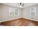 Bedroom boasts hardwood floors, a ceiling fan, and two windows for ample light at 2858 Valley Ridge Dr, Decatur, GA 30032
