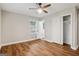Bedroom featuring hardwood floors, a ceiling fan, closet, and an ensuite bathroom at 2858 Valley Ridge Dr, Decatur, GA 30032