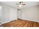 Bright bedroom features hardwood floors, ceiling fan, closet, and ensuite access at 2858 Valley Ridge Dr, Decatur, GA 30032