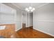 Elegant dining room with hardwood floors and classic chandelier, adjacent to the living area at 2858 Valley Ridge Dr, Decatur, GA 30032