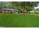 Inviting home with a lush green lawn and established landscaping enhancing curb appeal at 2858 Valley Ridge Dr, Decatur, GA 30032