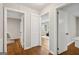 Hallway featuring hardwood floors, multiple doorways, and a closet for storage at 2858 Valley Ridge Dr, Decatur, GA 30032