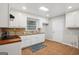 Bright kitchen featuring white cabinets, granite countertops, and tile backsplash at 2858 Valley Ridge Dr, Decatur, GA 30032