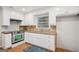 Well-lit kitchen features stainless steel appliances, granite countertops, and ample cabinet space at 2858 Valley Ridge Dr, Decatur, GA 30032