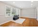 Light-filled living room featuring hardwood floors, neutral walls, and a cozy seating area at 2858 Valley Ridge Dr, Decatur, GA 30032