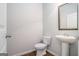 Charming half bath with pedestal sink and framed mirror at 3005 Nicholas Dr, Villa Rica, GA 30180