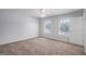 Bedroom with neutral carpet, a ceiling fan, and bright, sunny windows at 3005 Nicholas Dr, Villa Rica, GA 30180