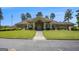 Beautiful clubhouse featuring manicured lawns, lush landscaping, and a grand entrance at 3005 Nicholas Dr, Villa Rica, GA 30180