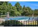 Large community pool surrounded by trees and lounge chairs, creating a relaxing atmosphere at 3005 Nicholas Dr, Villa Rica, GA 30180